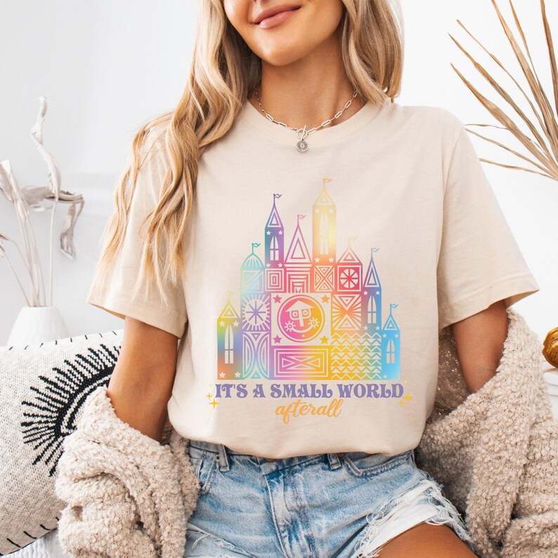 a woman wearing a t - shirt with a castle on it