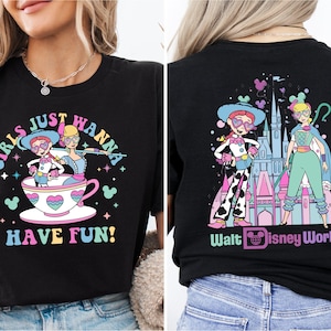 a woman wearing a disneyland world shirt