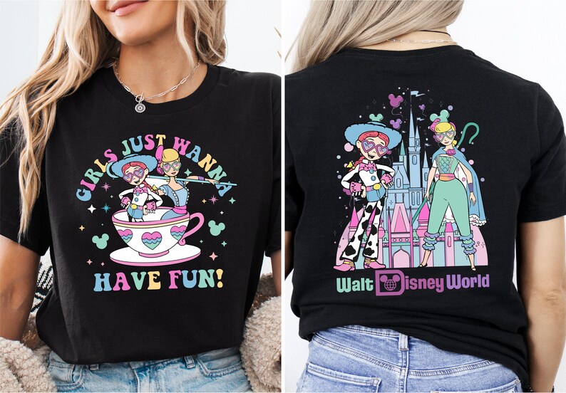 a woman wearing a disneyland world shirt