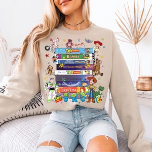 Disney All Characters Books Sweatshirt, Toy Sory And Lion King Library Shirt, Fantasy Bookish Club Sweater, Disneyworld Book Lover Gift Tee