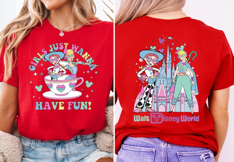 a woman wearing a red shirt with cartoon characters on it