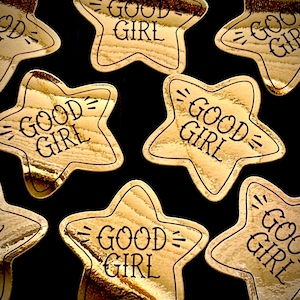 May include: A rustic wooden sign with the words "Welcome to our home" in white lettering. The sign has a distressed finish and a simple design, ideal for front door decoration.