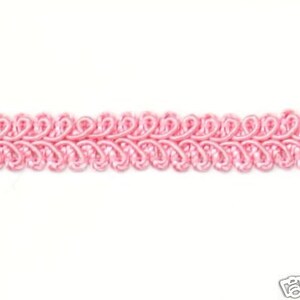 May include: Pink braided trim with a decorative, scalloped design. This trim is perfect for adding a touch of elegance to any project.