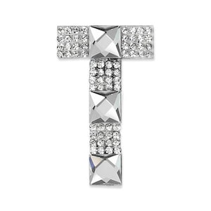 May include: A silver letter T made of rhinestones. The letter is made up of small, clear rhinestones that are set in a silver metal base. The letter is perfect for adding a touch of sparkle to any craft project.