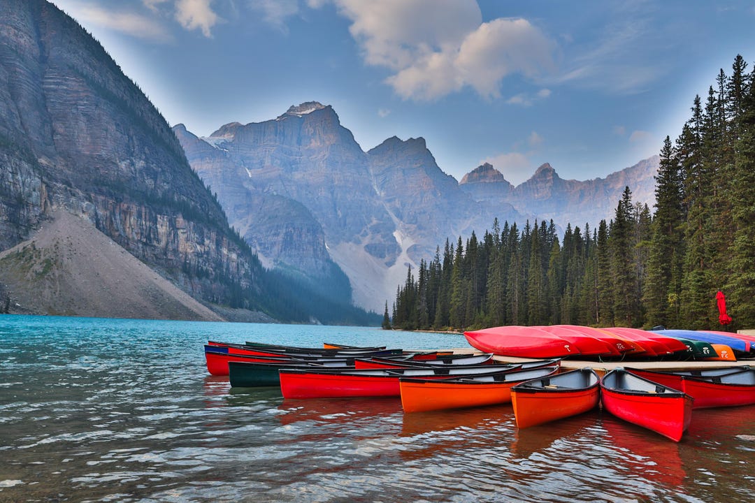The Infamous Canoes Lined up at Moraine Lake Are One of the Most Iconic ...
