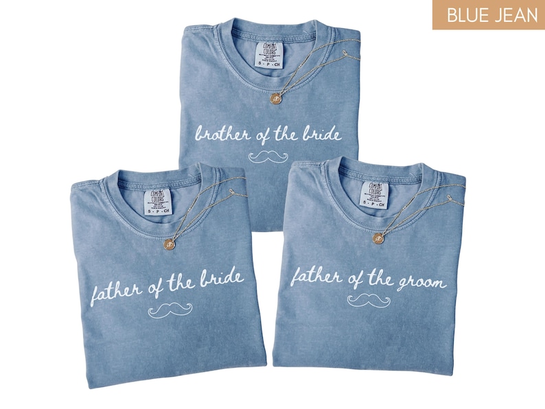 May include: Three blue jean-coloured t-shirts with white text and a moustache graphic. The shirts say "brother of the bride", "father of the bride", and "father of the groom". Each shirt has a gold necklace.