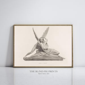 Puede incluir: Una impresión en blanco y negro de una escultura que representa una figura alada abrazando a otra figura. La impresión está enmarcada en un marco dorado y tiene el texto "THE BLIND PIG PRINTS PRINTABLE ART" debajo de la imagen.