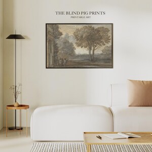 May include: A framed sepia-toned print of a landscape scene with a large tree in the foreground and a building in the background. The print is titled "The Blind Pig Prints Printable Art".