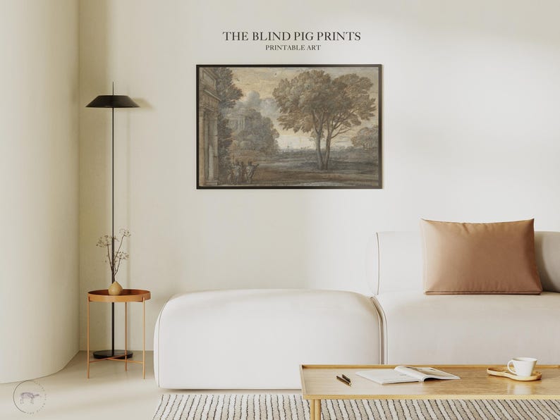 May include: A framed sepia-toned print of a landscape scene with a large tree in the foreground and a building in the background. The print is titled "The Blind Pig Prints Printable Art".