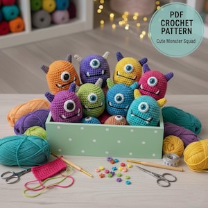 May include: A collection of colorful, crocheted monster toys in a light green box with white polka dots. The monsters are various colors, including orange, purple, yellow, green, blue, and pink. The image also includes yarn, scissors, and the text "PDF Crochet Pattern Cute Monster Squad."