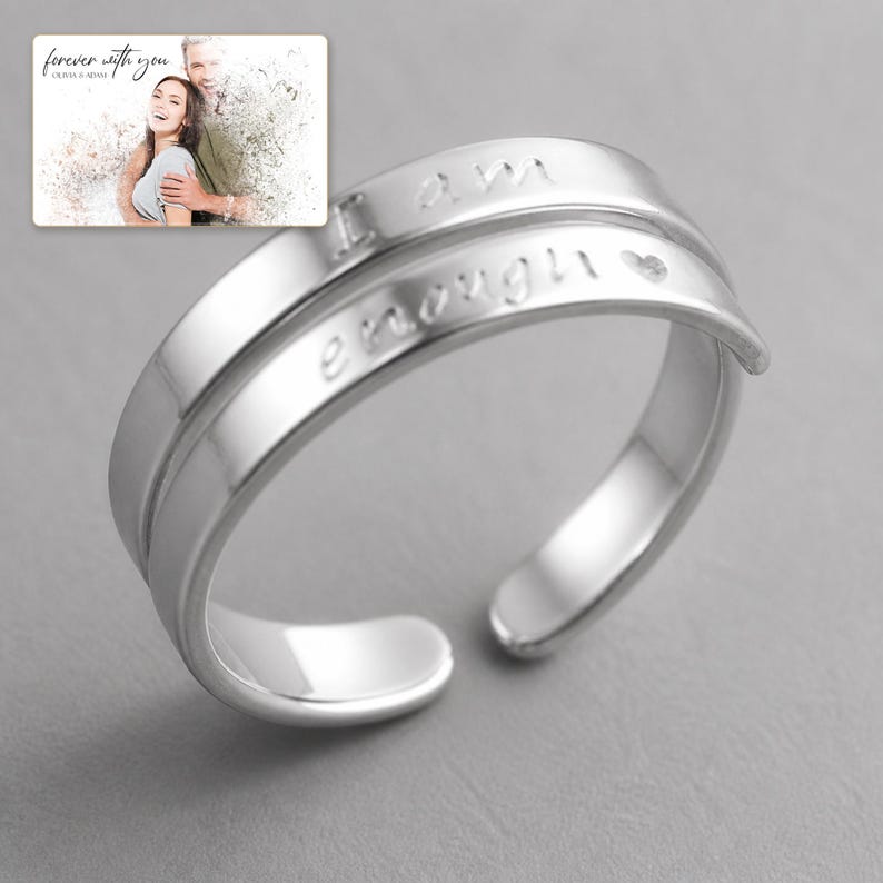 Brave Word Open Band Ring shown during a warm gift-receiving moment between adults with the exact jewelry visible.