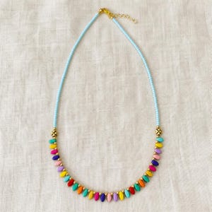 Four piece colorful handmade beaded necklace set with red turquoise green orange and multicolor boho designs