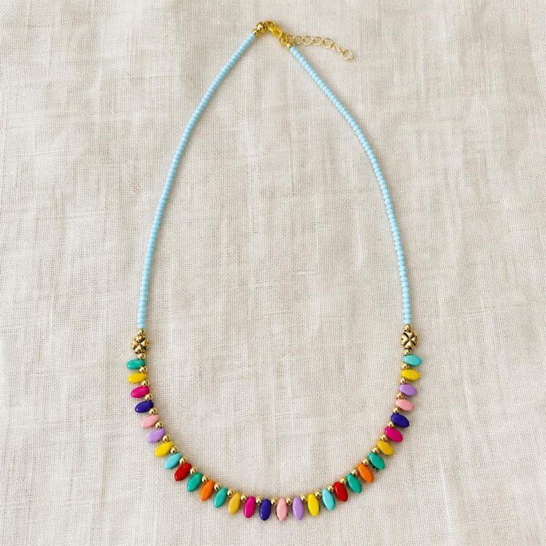 Four piece colorful handmade beaded necklace set with red turquoise green orange and multicolor boho designs