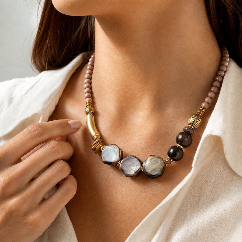 Brown and Beige Statement Beaded Necklace presented in an open jewelry gift box on natural linen