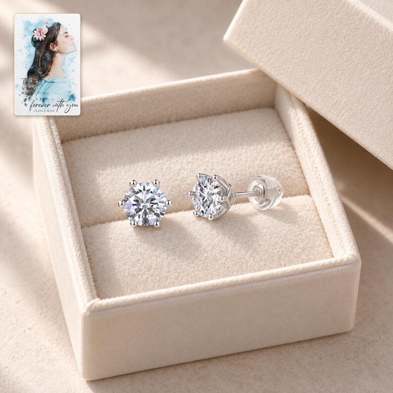 Moissanite Stud Earrings, displayed in a presentation box. A sample personalized digital greeting card is shown alongside.
