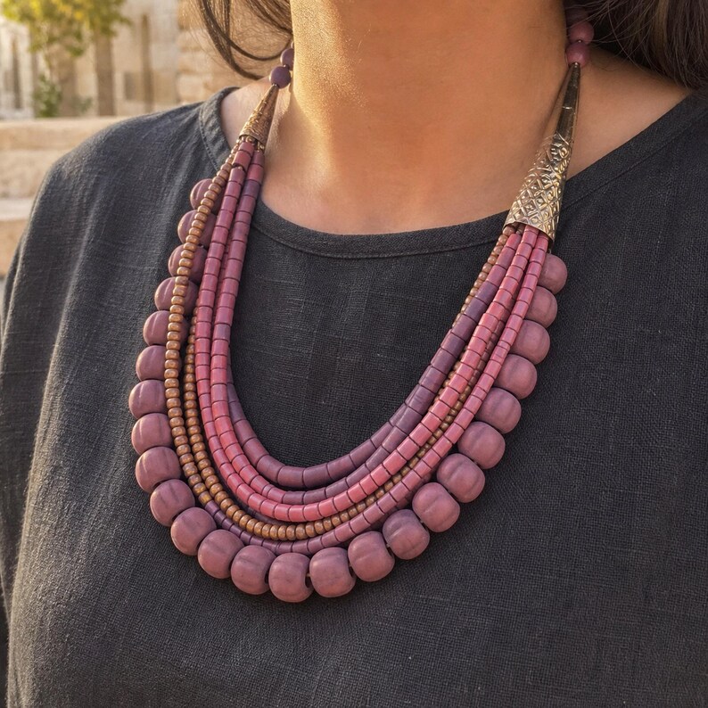 Three-piece handmade necklace set featuring rose gold and brown beaded necklace, rose gold and brown beaded necklace and rose gold and brown beaded necklace, displayed together to show the coordinated colors and beadwork