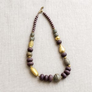 Green turquoise and coral statement beaded necklace with lotus charm from the four piece set
