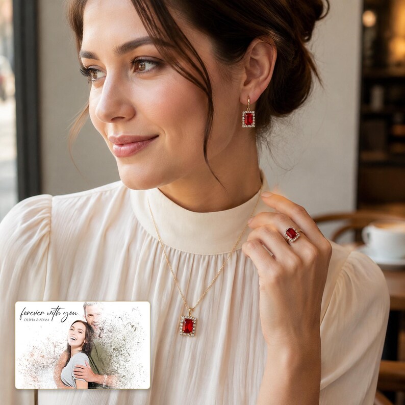 Red rectangular-stone necklace, matching earrings and ring, adult lifestyle view. A personalized greeting-card example appears in the corner.