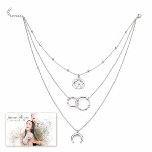 Silver Moon Map Layers shown during a believable gift-giving moment between adults with the exact jewelry visible.