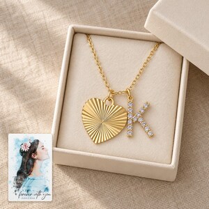 K Initial Heart Necklace, gift box view. A personalized digital greeting card is shown alongside.