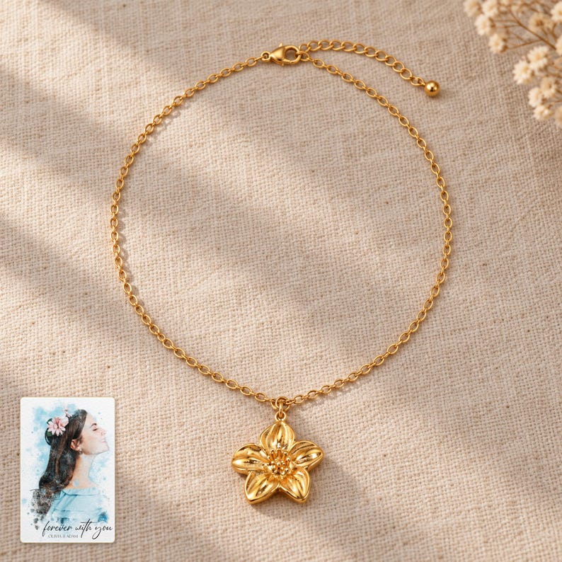 Gold Tone Flower Necklace, laid on fabric. A sample personalized digital greeting card is shown alongside.