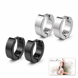 EdgeLine Stainless Huggie Hoops worn by an adult model for realistic scale and everyday styling.