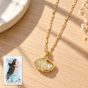 Shell Shaped Necklace, sunlit home view. A personalized digital greeting card is shown alongside.