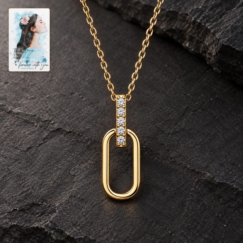 Oval Link Moissanite Necklace, shown against a dark background. A sample personalized digital greeting card is shown alongside.