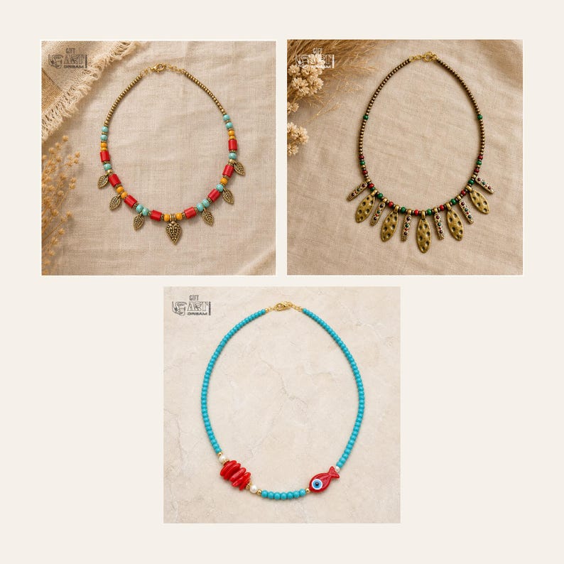 May include: Three necklaces are displayed. The first features red, yellow, and turquoise beads with gold-tone leaf charms. The second has green, red, and gold beads with elongated gold-tone pendants. The third has turquoise beads, red accents, and a fish charm.