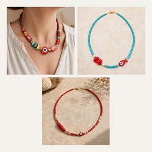 May include: Three necklaces featuring varied bead designs. One necklace has large multi-colored beads and a red evil eye charm. Another has turquoise beads, red coral-like segments, and a red fish charm. The third has red beads and a small evil eye.