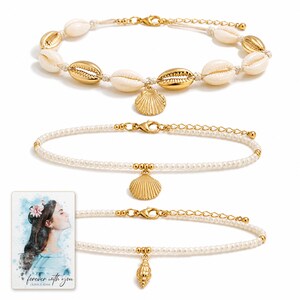 Beach Muse Three-Piece Shell Anklet Set shown during a believable gift-giving moment between adults with the exact jewelry visible.