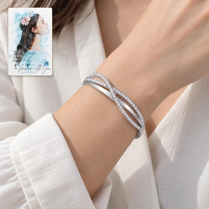 Crossover Bangle Bracelet, worn by an adult. A sample personalized digital greeting card is shown alongside.