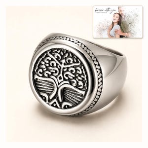 Silver-tone ring with a round tree motif, catalog view. A personalized greeting-card example appears in the corner.