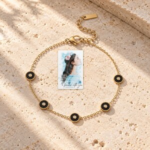 Black Disc Bracelet, shown in natural light. A sample personalized digital greeting card is shown alongside.