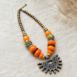 Gift ready presentation of Orange and Brown Statement Beaded Necklace, Boho Handmade Jewelry, Artisan Gift for Her in an open jewelry box lined with natural ivory linen