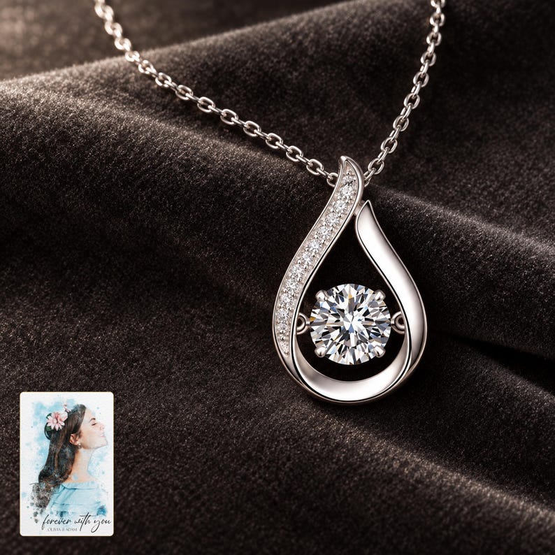 Moissanite Teardrop Necklace, shown against a dark background. A sample personalized digital greeting card is shown alongside.