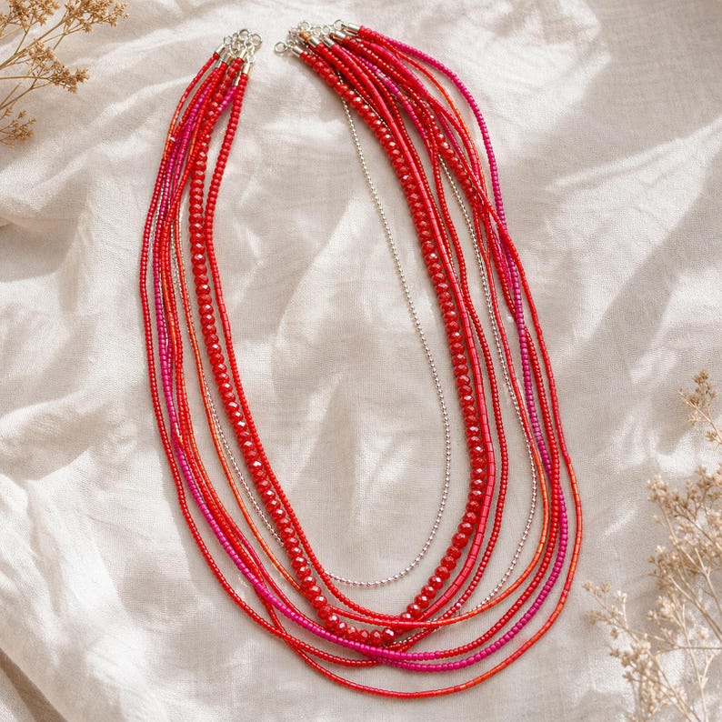 Gift ready presentation of Red and Gray Statement Beaded Necklace, Boho Handmade Jewelry, Artisan Gift for Her in an open jewelry box lined with natural ivory linen