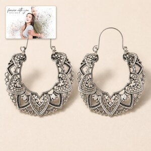 Antique Lace Boho Hoops photographed in warm natural window light in an elegant home setting.