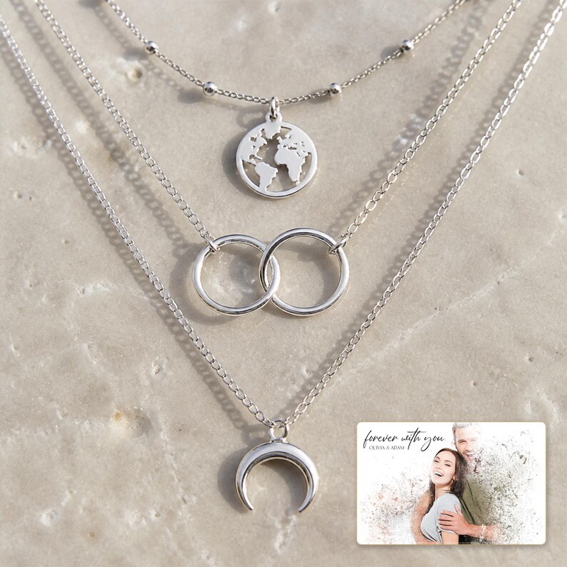 Silver Moon Map Layers shown during a warm gift-receiving moment between adults with the exact jewelry visible.
