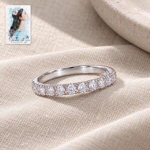 Moissanite Half Eternity Ring, laid on fabric. A sample personalized digital greeting card is shown alongside.