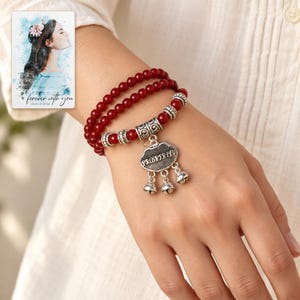 Crimson Agate style Charm Wrap Bracelet worn by an adult model for styling and everyday styling. A personalized digital greeting card is shown alongside.