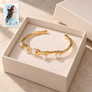 Gold Tone Cuff Bracelet, displayed in a presentation box. A sample personalized digital greeting card is shown alongside.