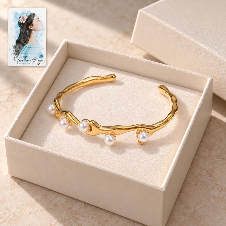 Gold Tone Cuff Bracelet, displayed in a presentation box. A sample personalized digital greeting card is shown alongside.