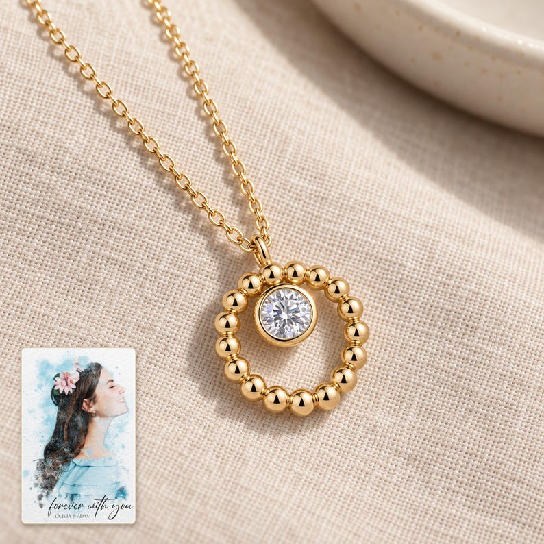 Moissanite Circle Necklace, linen flatlay view. A personalized digital greeting card is shown alongside.
