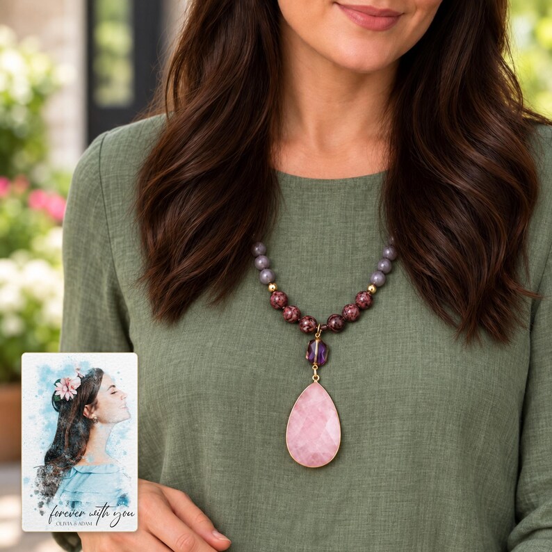 Adult wearing the pink pendant necklace with sage clothing; hair covers the upper strand while the lower bead groups and pendant remain visible. A personalized digital greeting card is shown alongside.