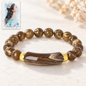 Cocoa Swirl Bar Bracelet shown in a close macro view highlighting the visible texture, texture and construction details. A personalized digital greeting card is shown alongside.
