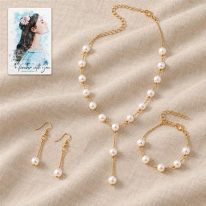 pearl style Occasion Jewelry Set arranged on soft ivory linen in a refined neutral flat lay. A personalized digital greeting card is shown alongside.