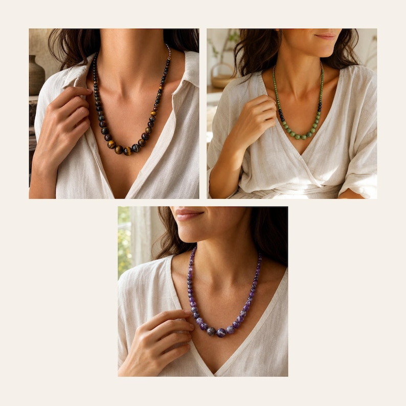 May include: Three beaded necklaces featuring round polished stones. One necklace consists of brown and gold tiger eye beads, another features green beads, and the third displays purple amethyst-toned beads, all arranged in a graduated style.