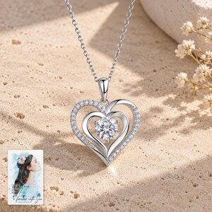 Double Heart Moissanite Necklace, shown in natural light. A sample personalized digital greeting card is shown alongside.