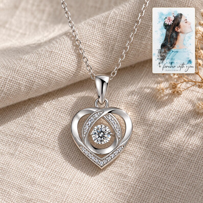 Moissanite Heart Necklace, linen flatlay view. A personalized digital greeting card is shown alongside.